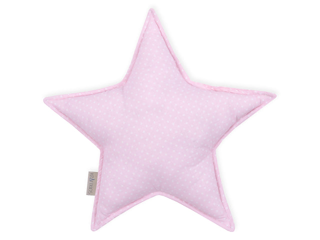 Cuscino a stella con punti bianchi su sfondo rosa