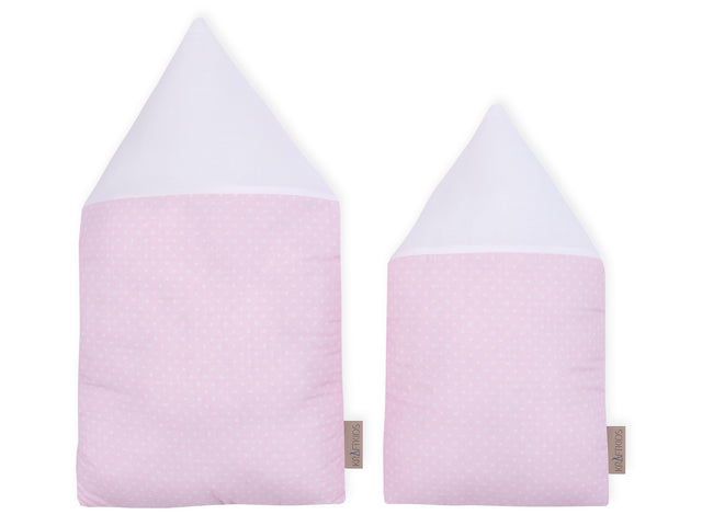 Casa in tessuto a tinta unita bianca con puntini bianchi su rosa