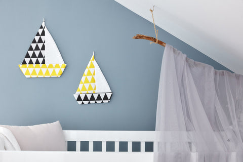 Triangoli gialli della barca a vela