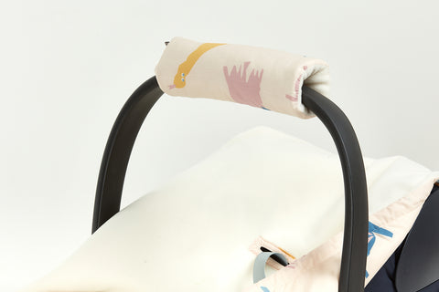 Protezione bracciolo per seggiolino per bambini Il dinosauro di Zoe su beige