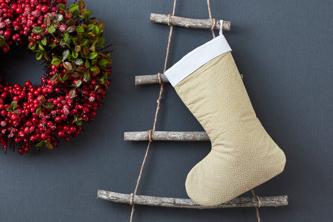 Calza natalizia puntini irregolari dorati su verde oliva