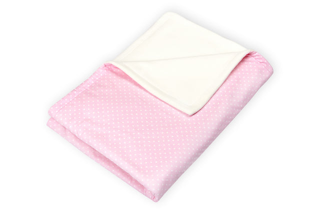 Coperta per bebè con puntini bianchi su sfondo rosa
